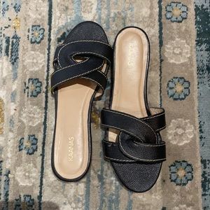 Kaanas black twisted slides / sandals